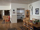 Nyvoll Brygge - jidelni kout a kuchyne v domku